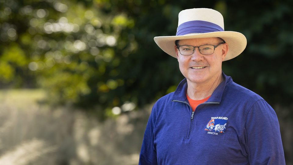 Dr. Mark Spede in a white hat and Clemson purple